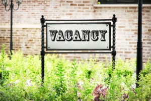 Signboard with text Vacancy near hotel