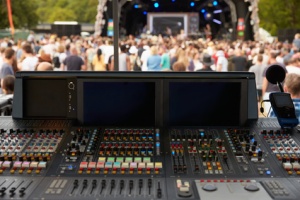 Sound and lighting desk at an outdoor festival concert